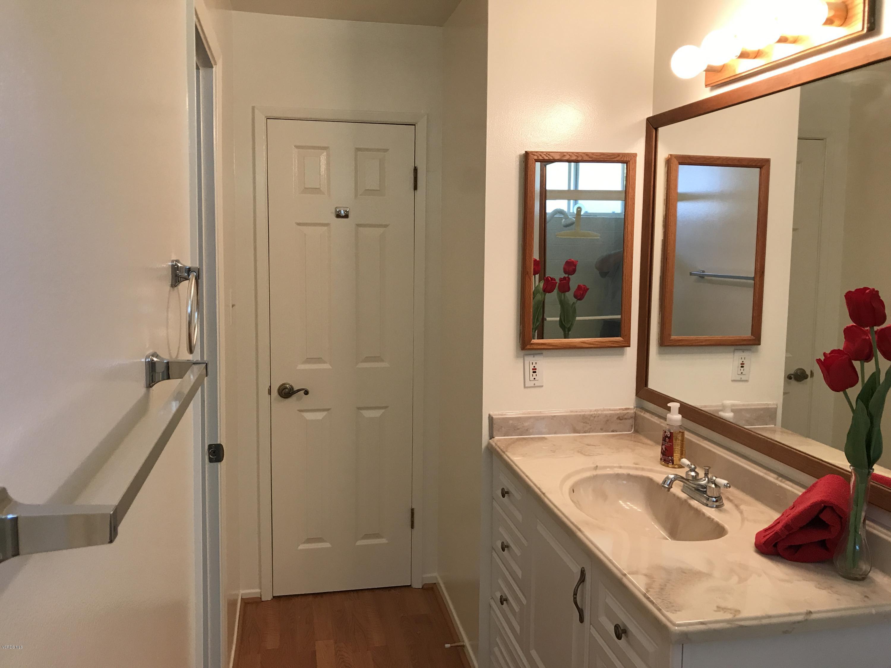 3920 Russ Court Simi Valley, CA 93063 - Photo 22 of 32 a bathroom with a sink and a mirror