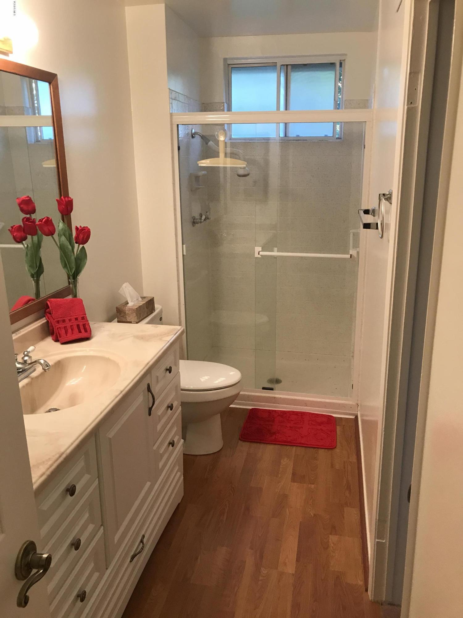 3920 Russ Court Simi Valley, CA 93063 - Photo 23 of 32 a bathroom with a sink toilet and shower