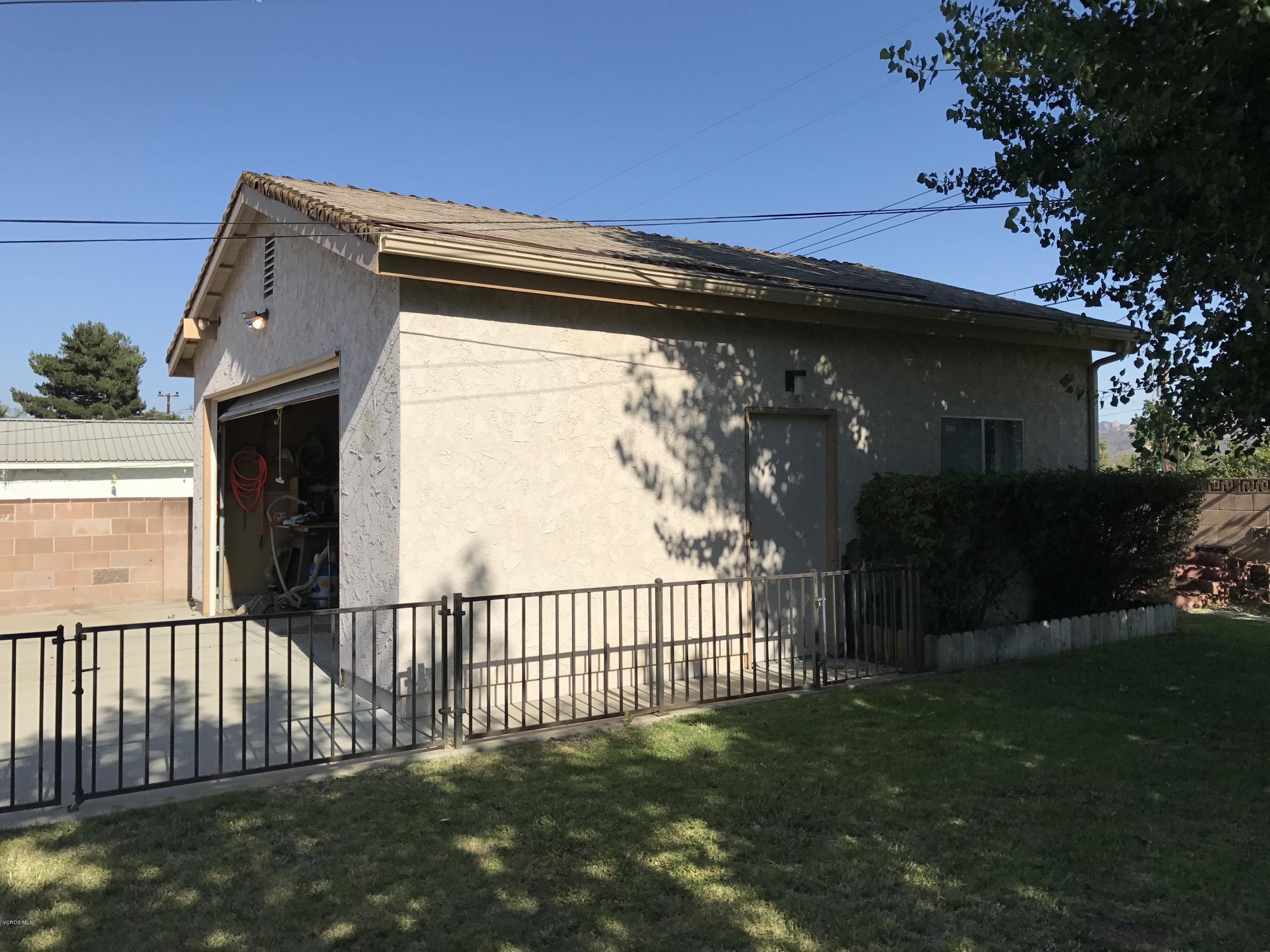 3920 Russ Court Simi Valley, CA 93063 - Photo 28 of 32 a view of a house with a small yard and a large tree