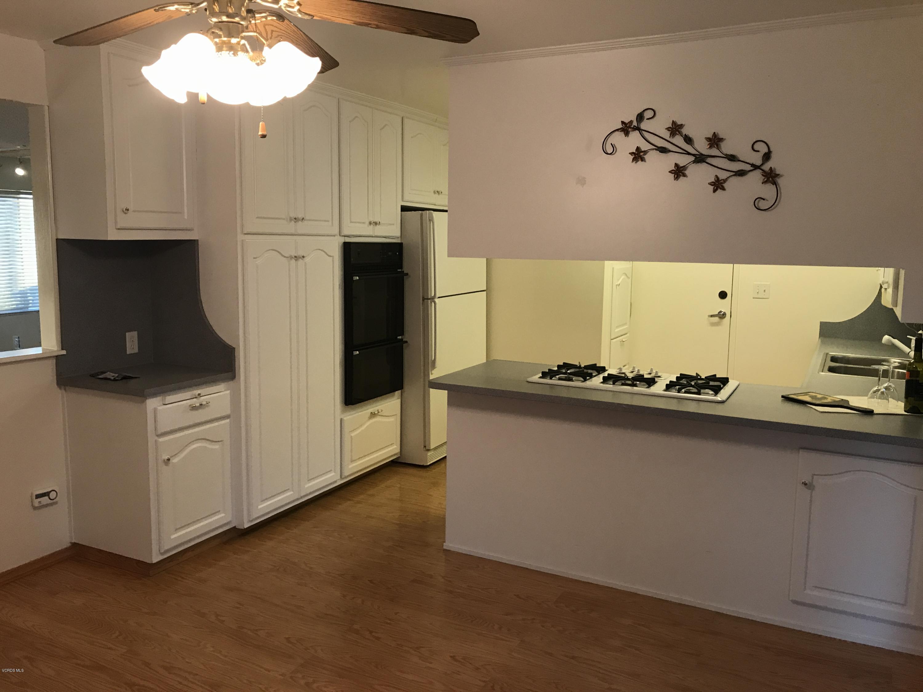 3920 Russ Court Simi Valley, CA 93063 - Photo 5 of 32 a kitchen with cabinets and window