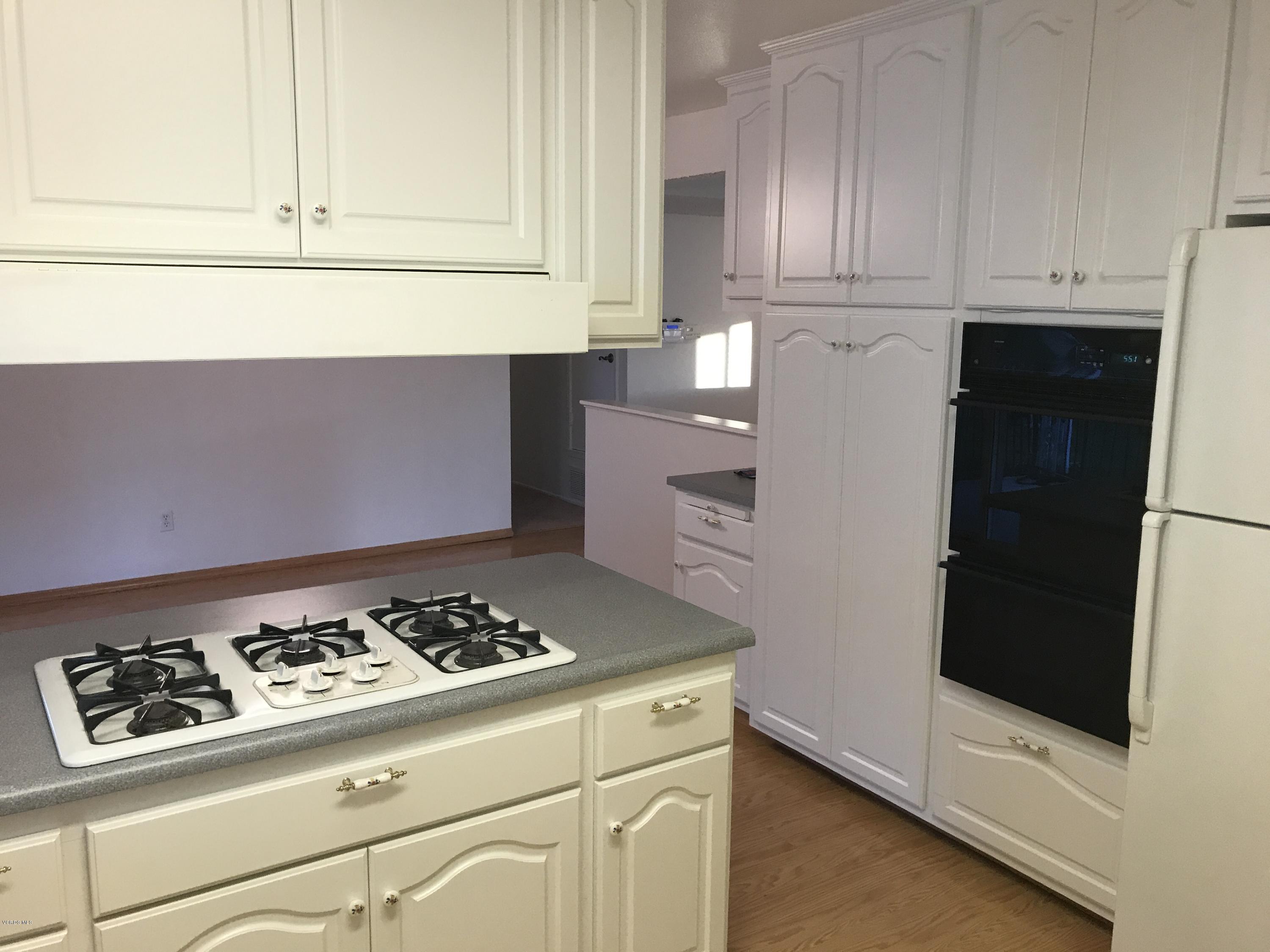 3920 Russ Court Simi Valley, CA 93063 - Photo 6 of 32 a kitchen with granite countertop cabinets and appliances