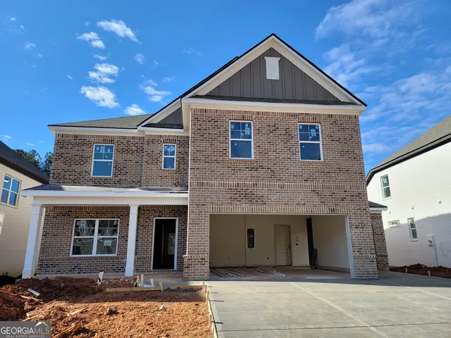 a front view of a house with yard