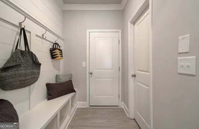 a view of hallway with stairs and a couch