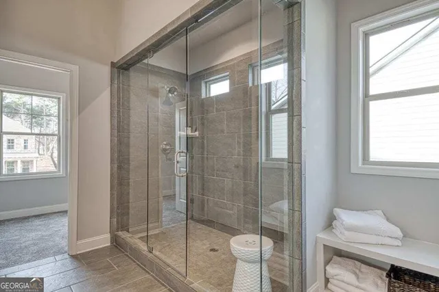 a bathroom with a shower and toilet