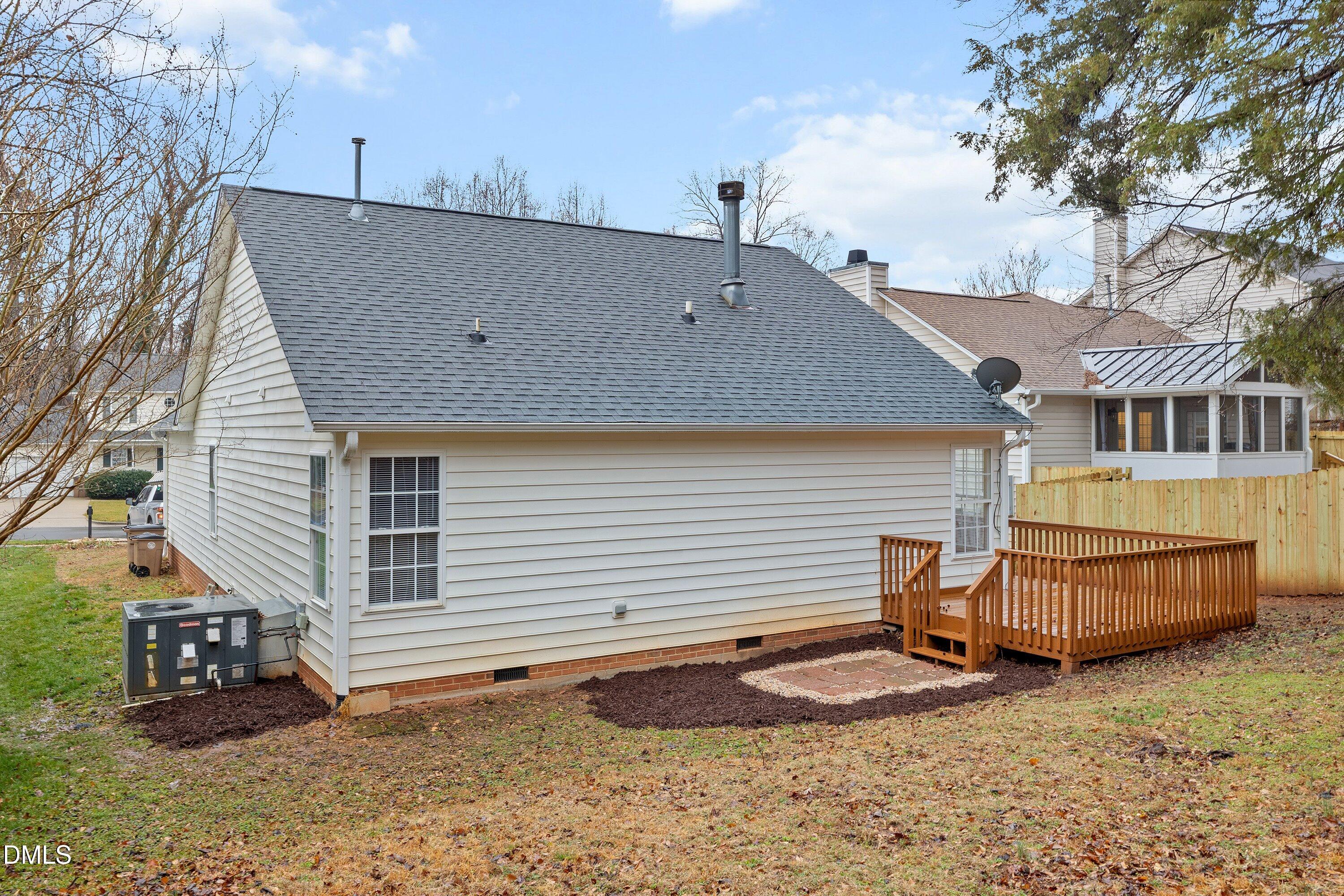 140 Melksham Road Wake Forest, NC 27587 - Photo 5 of 34 a backyard of a house with barbeque oven and outdoor seating