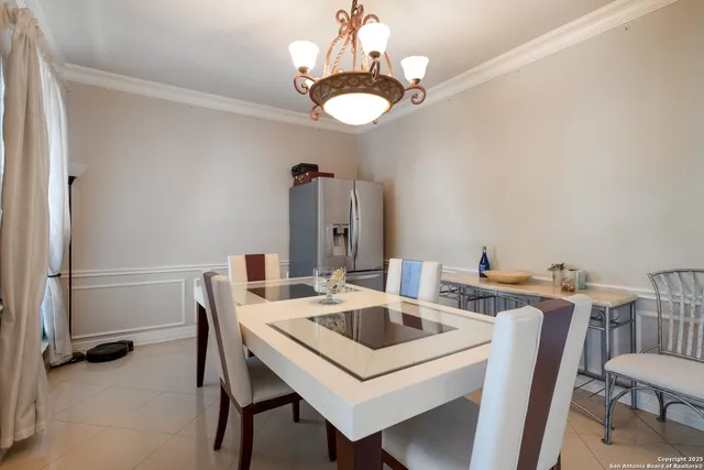 a kitchen that has a table and chairs in it