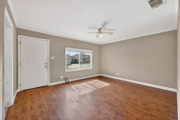 a view of an empty room with a window