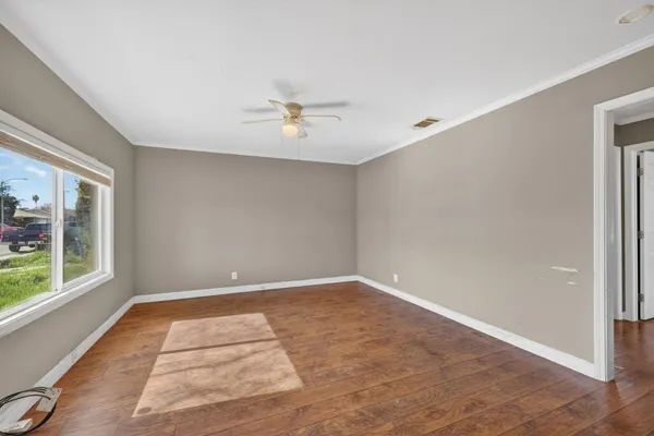 a view of an empty room with a window