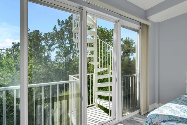 a view of a balcony with chair