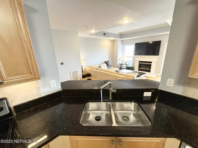 a bedroom with a bed and a ceiling fan