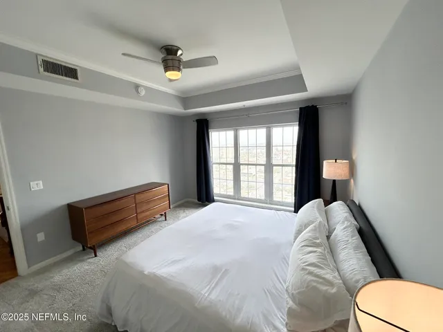 a kitchen with granite countertop a sink a stove and cabinets