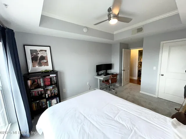 an aerial view of a house with a garden and lake view