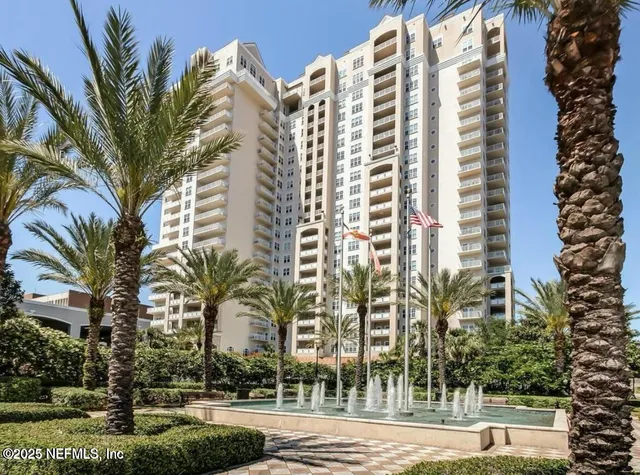 a spacious bedroom with a bed and a couch