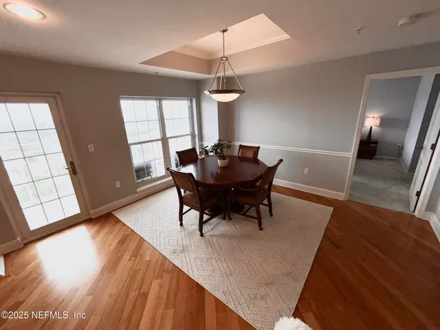 a kitchen with granite countertop a sink stainless steel appliances and cabinets