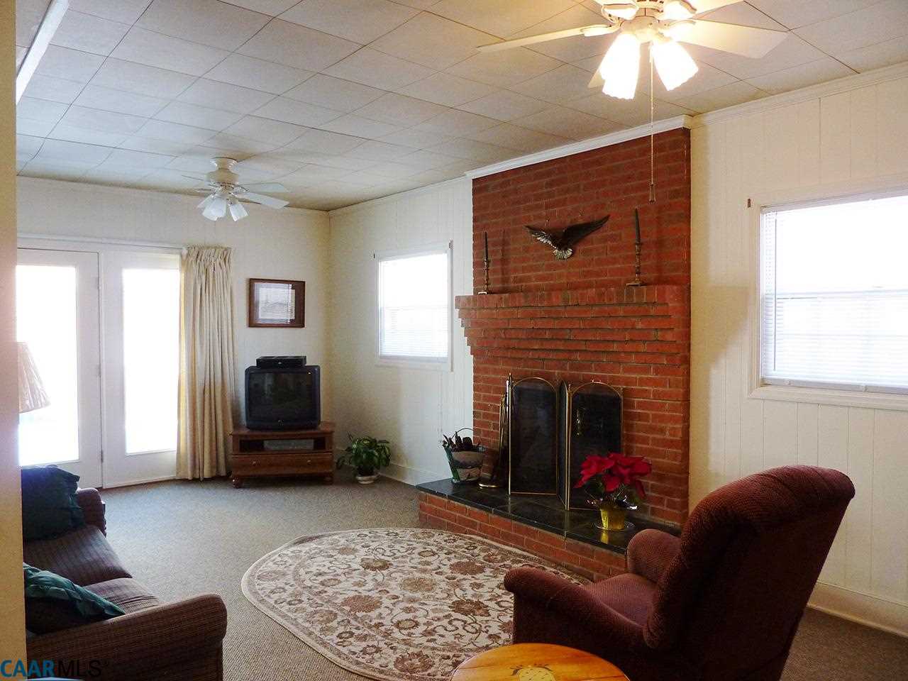 606 Shamrock Road Charlottesville, VA 22903 - Photo 13 of 19 a living room with furniture and a fireplace