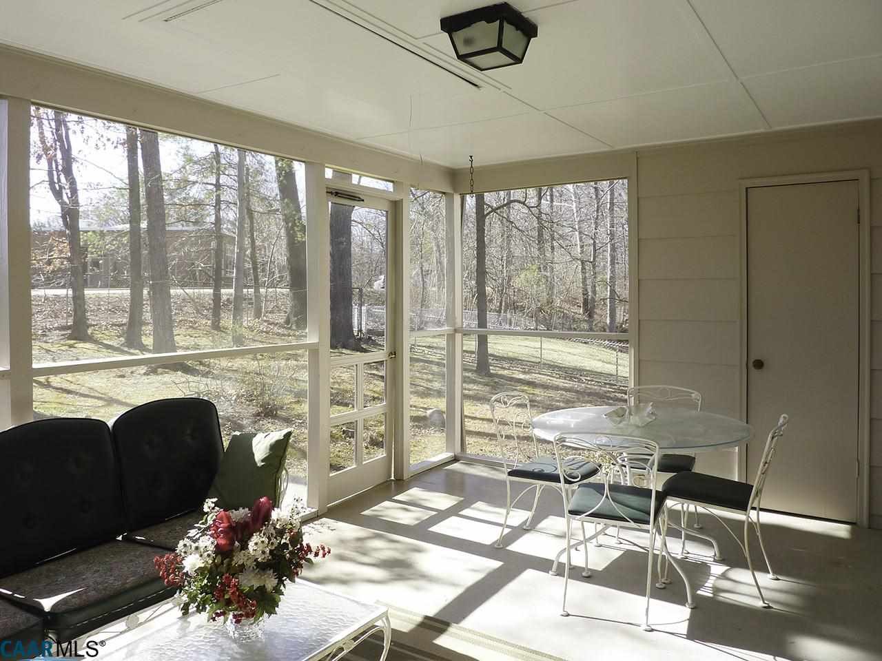 606 Shamrock Road Charlottesville, VA 22903 - Photo 17 of 19 a living room with fireplace furniture and a floor to ceiling window