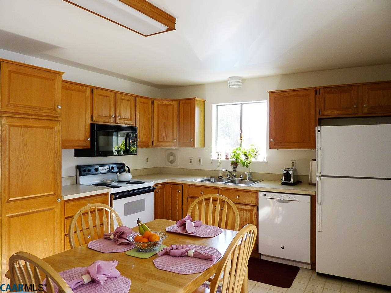 606 Shamrock Road Charlottesville, VA 22903 - Photo 4 of 19 a kitchen with a sink stove and refrigerator