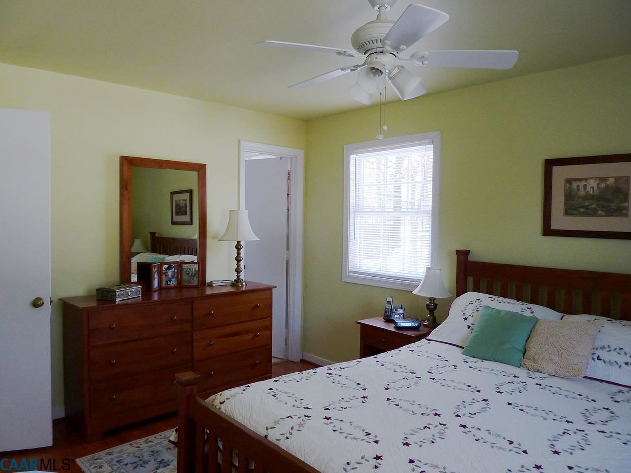 606 Shamrock Road Charlottesville, VA 22903 - Photo 8 of 19 a bedroom with a bed and a dresser