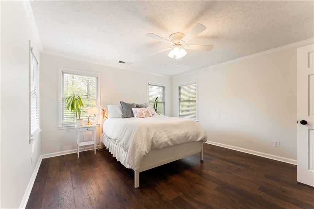 402 Hunters Court Ball Ground, GA 30107 - Photo 13 of 56 a bedroom with a bed and a window