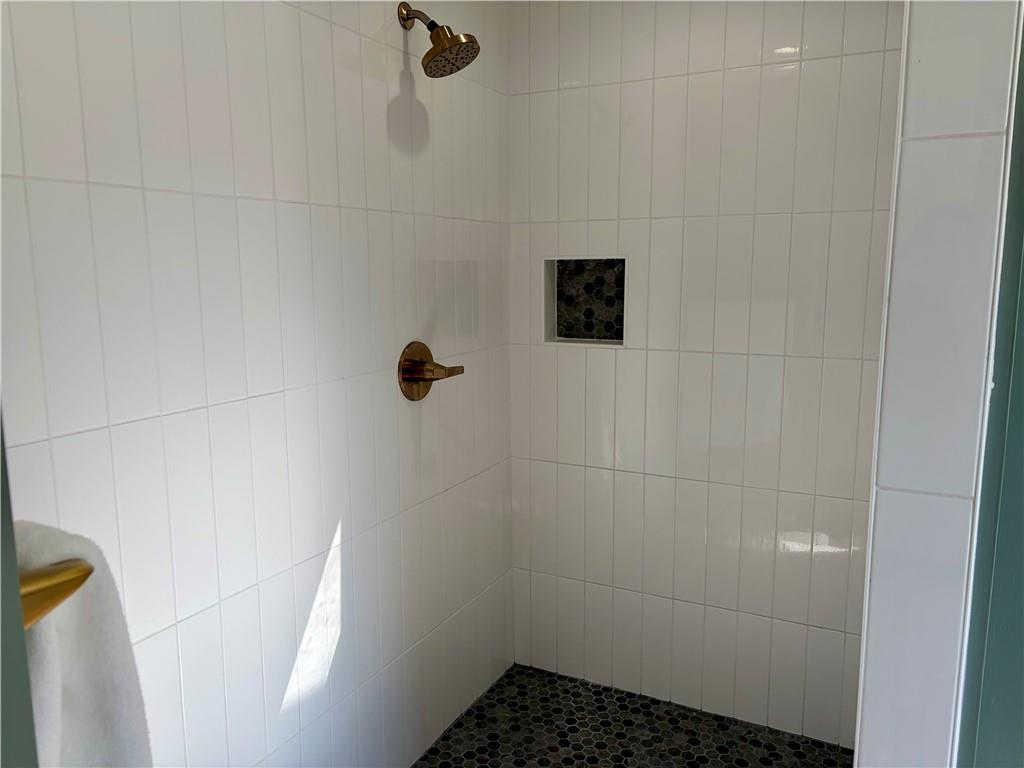 402 Hunters Court Ball Ground, GA 30107 - Photo 20 of 56 a bathroom with a shower