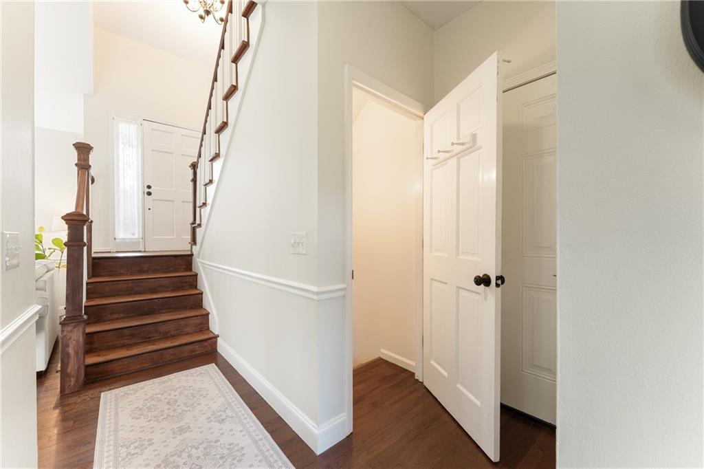 402 Hunters Court Ball Ground, GA 30107 - Photo 29 of 56 a view of a hallway with wooden floor and entryway