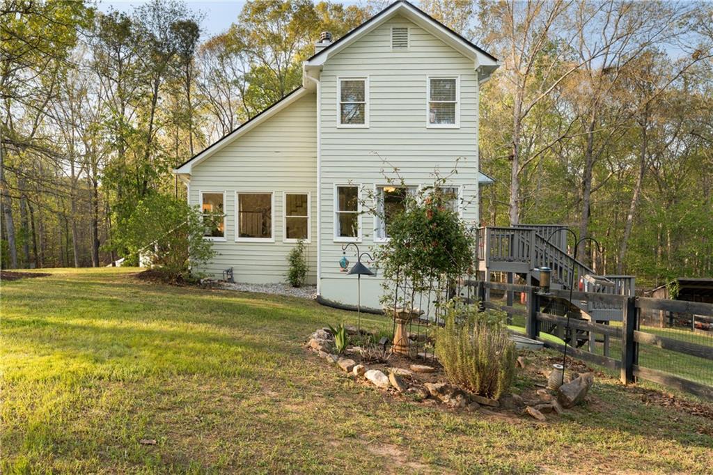 402 Hunters Court Ball Ground, GA 30107 - Photo 40 of 56 a view of a house with backyard and sitting area