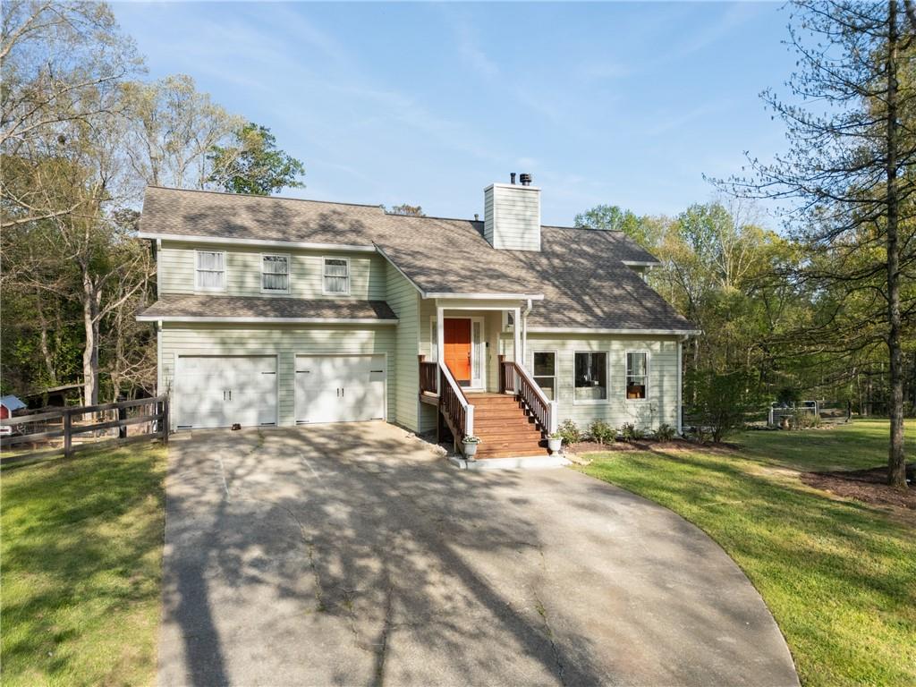 402 Hunters Court Ball Ground, GA 30107 - Photo 47 of 56 a view of a house with a yard