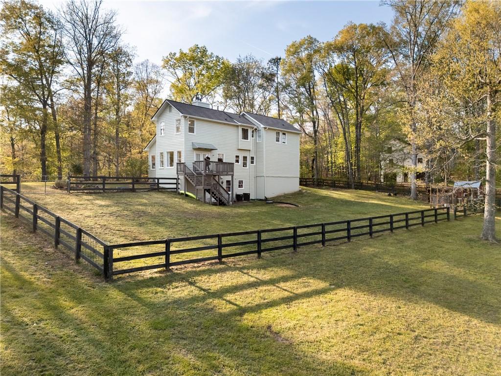 402 Hunters Court Ball Ground, GA 30107 - Photo 49 of 56 a view of a house with swimming pool