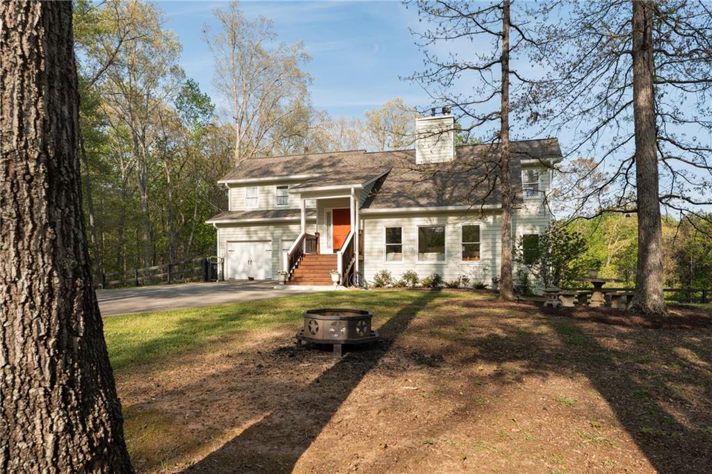 402 Hunters Court Ball Ground, GA 30107 - Photo 56 of 56 a view of a house with backyard