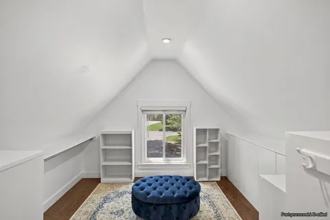 a bedroom with a bed a desk and chair