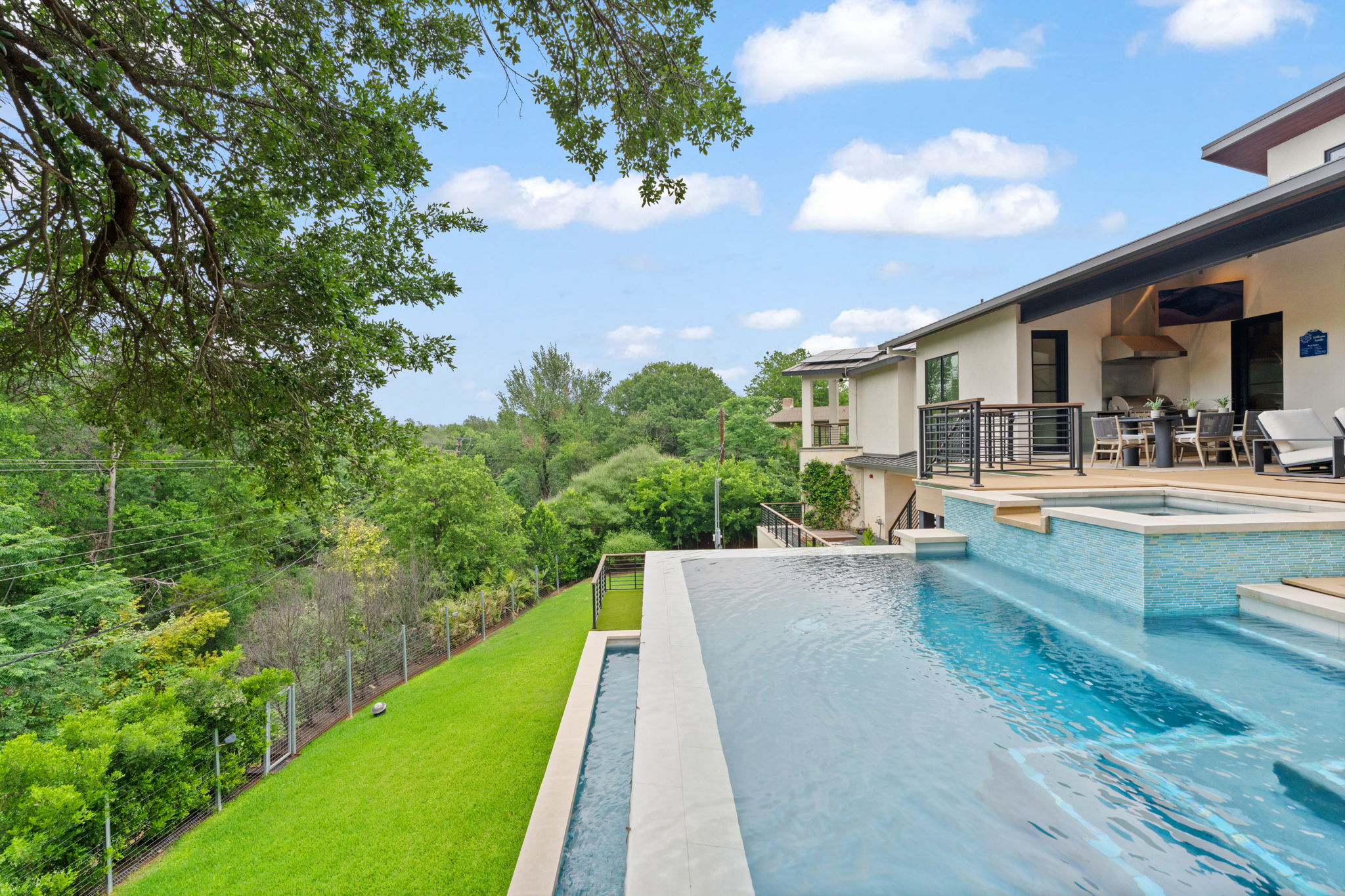 604 Brookhaven Trail Austin, TX 78746 - Photo 30 of 38 Infinity-edge pool on the main floor with spa.