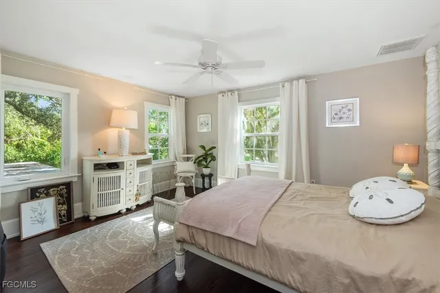 a bedroom with a bed and a fireplace