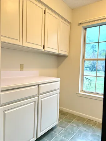 a view of cabinets and window