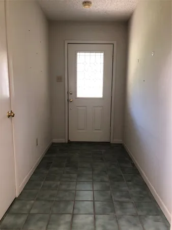 a view of a hallway with a window