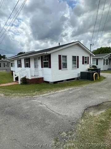 a house view with a garden space