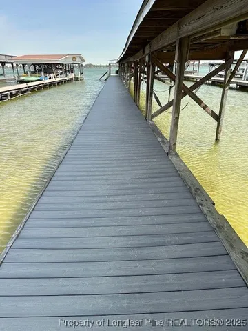 a view of swimming pool with outdoor seating
