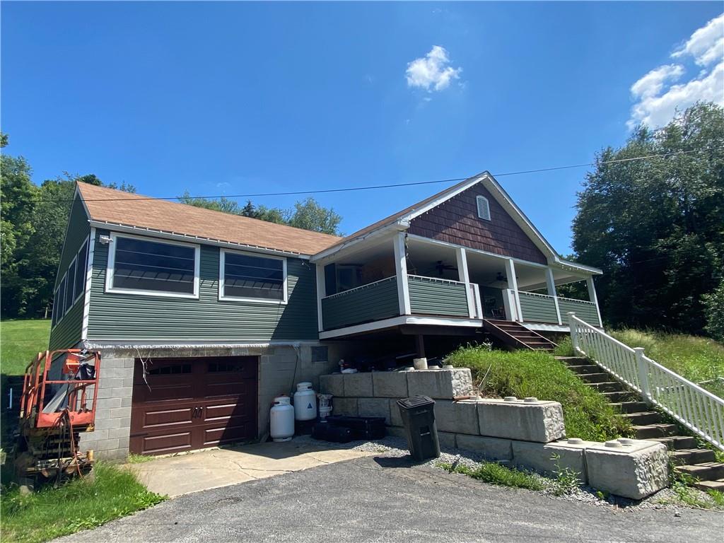 989 Blackhawk Road Beaver Falls, PA 15010 - Photo 1 of 18 a front view of a house with a yard