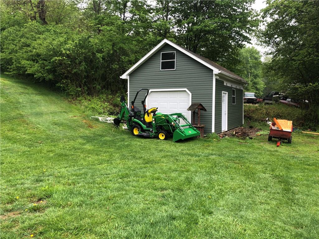 989 Blackhawk Road Beaver Falls, PA 15010 - Photo 17 of 18 a front view of a house with garden