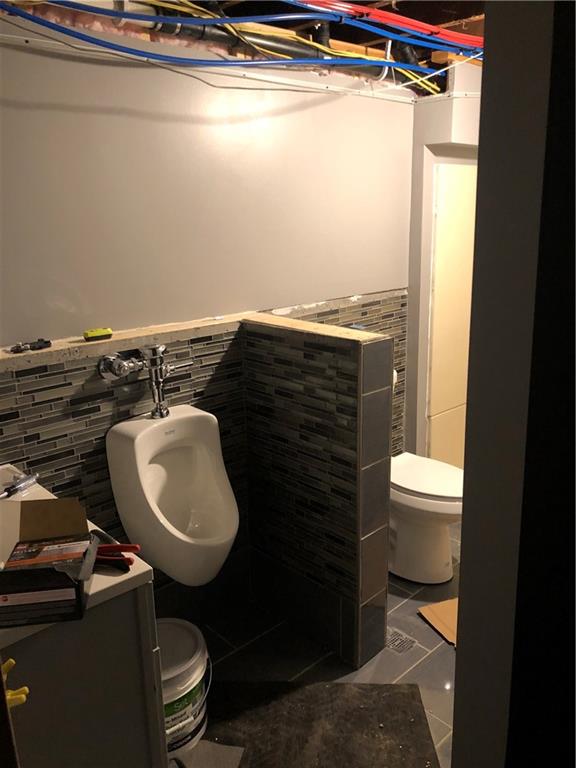 989 Blackhawk Road Beaver Falls, PA 15010 - Photo 18 of 18 a bathroom with a toilet a sink and a shower