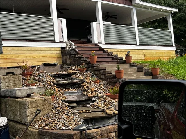 a view of a couple of cars parked in front of a house