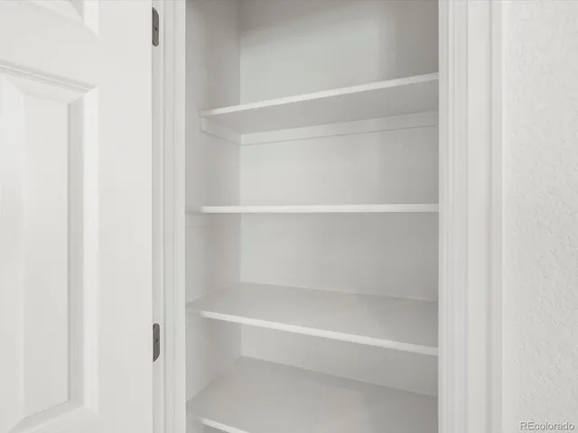 a bathroom with a toilet sink and a mirror