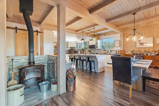 a living room with furniture and a glass door