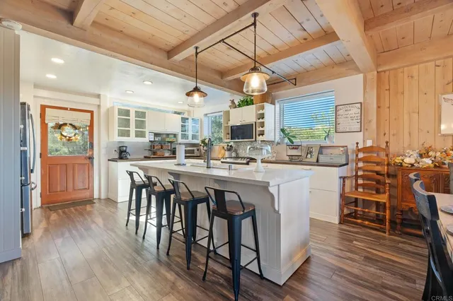 a spacious bathroom with a double vanity sink mirror and toilet