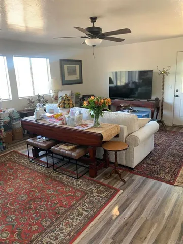 an aerial view of a house with a mountain