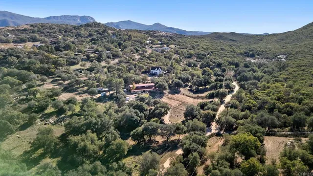 an aerial view of residential house with outdoor space