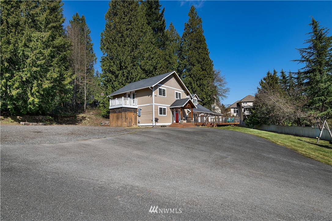 17325 3rd Avenue Southeast Bothell, WA 98012 - Photo 2 of 40 a view of a house with a yard and large trees
