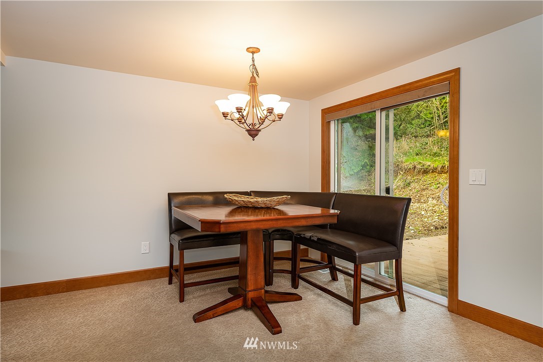 17325 3rd Avenue Southeast Bothell, WA 98012 - Photo 15 of 40 a view of a dining room with furniture and chandelier