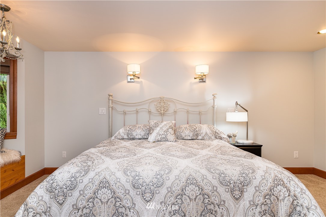 17325 3rd Avenue Southeast Bothell, WA 98012 - Photo 21 of 40 a bedroom with a bed and a night stand