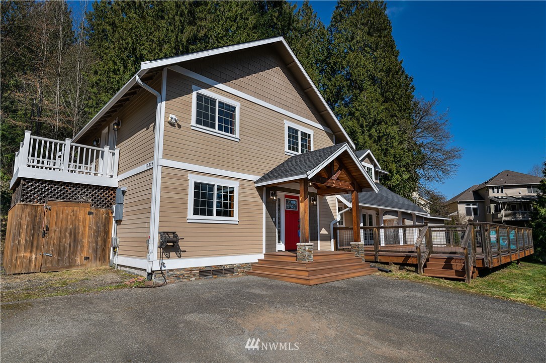 17325 3rd Avenue Southeast Bothell, WA 98012 - Photo 4 of 40 a front view of a house with a yard and garage