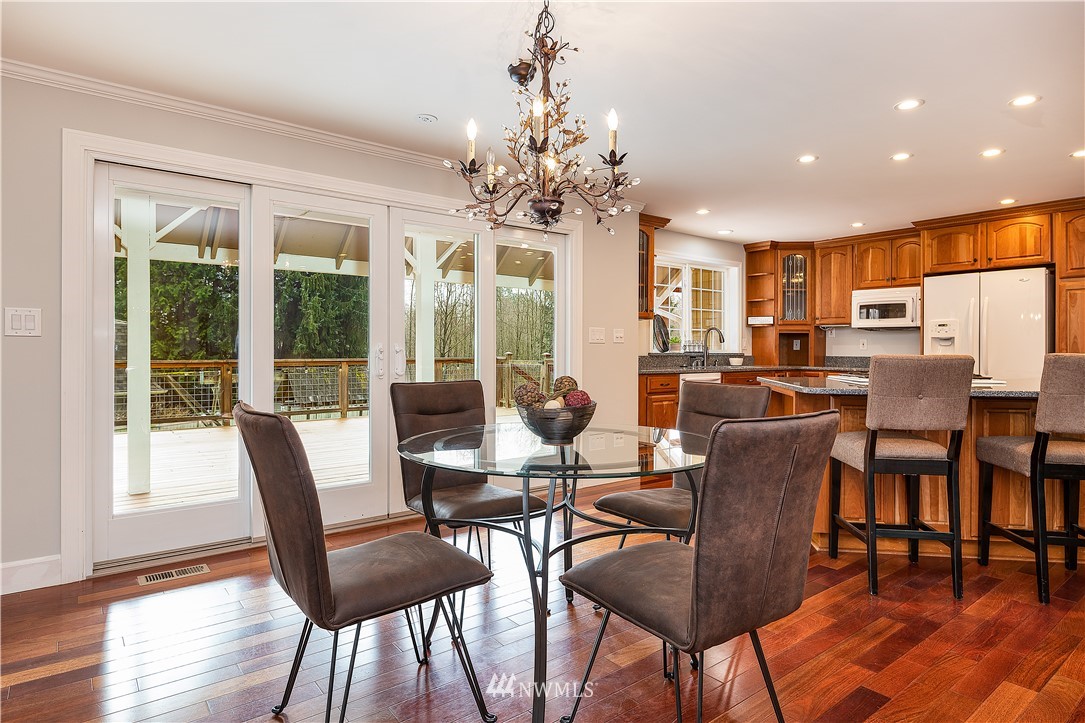 17325 3rd Avenue Southeast Bothell, WA 98012 - Photo 7 of 40 a view of a dining room with furniture window and wooden floor